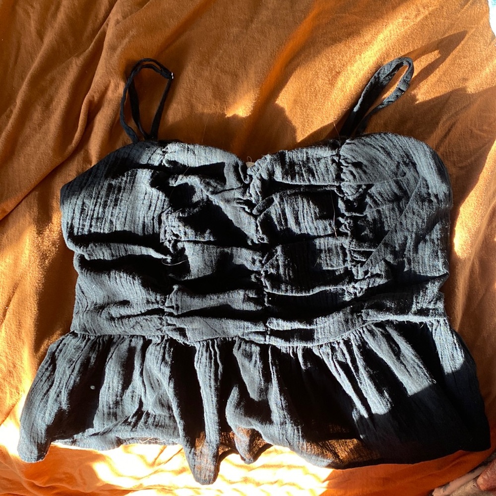 This is a Newbury Kustom Crop top.